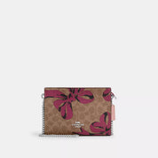 Coach Outlet Slim Crossbody Bag In Signature Canvas With Bow Print