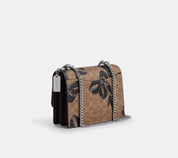 Coach Klare Crossbody Bag In Signature Canvas With Bow Print