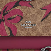 Coach Outlet Klare Crossbody Bag In Signature Canvas With Bow Print