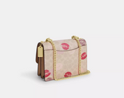 Coach Klare Crossbody Bag In Signature Canvas With Lips Print