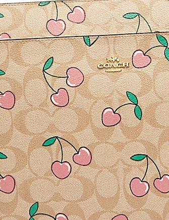 Coach-Laptop-Sleeve-In-Signature-Canvas-With-Heart-Cherry-Print-2-02.png