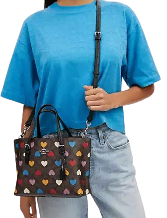 Coach-Mollie-Tote-25-In-Signature-Canvas-With-Heart-Print-4-02_d228841c-5b02-49c9-8616-6ba1e7a2d4e0.png