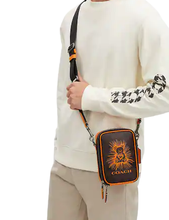 Coach-Stanton-Crossbody-In-Signature-Canvas-With-Bear-3-02.png