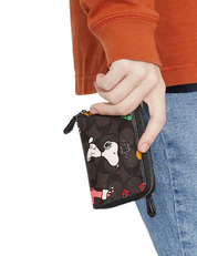 Coach Coach X Peanuts Small Zip Around Wallet In Signature Canvas With Snoopy Presents Print