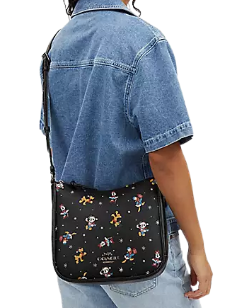 Disney-X-Coach-Ellie-File-Bag-With-Holiday-Print-4-02.png