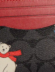 Coach Slim Id Card Case In Signature Canvas With Polar Bear Print