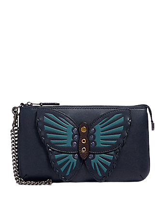 coach-large-wristlet-with-butterfly-applique.png