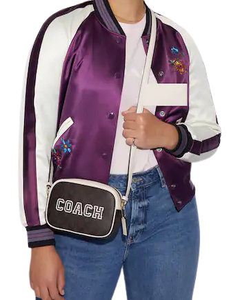 coach-mini-jamie-camera-bag-in-signature-canvas-with-varsity-motif-01.png